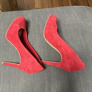 Red suede pumps